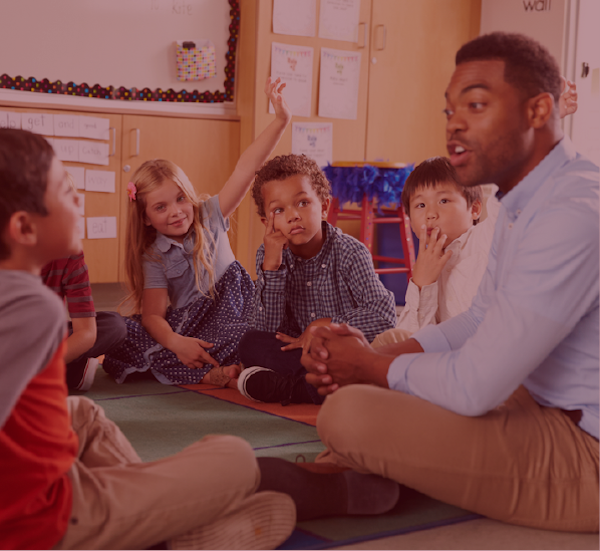 Teacher talking to a group of children