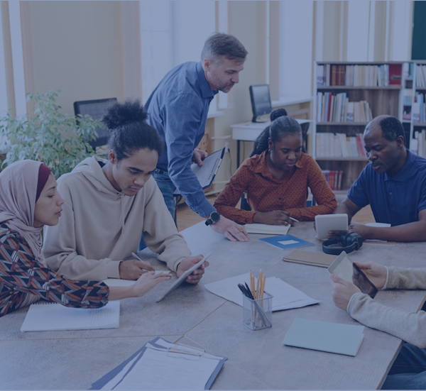 Professionals gathered around a table, working